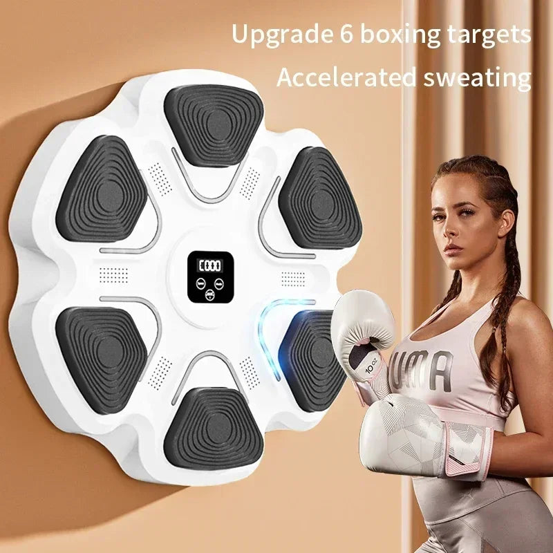 Woman in sportswear with boxing gloves next to wall-mounted electronic boxing target for home gym.