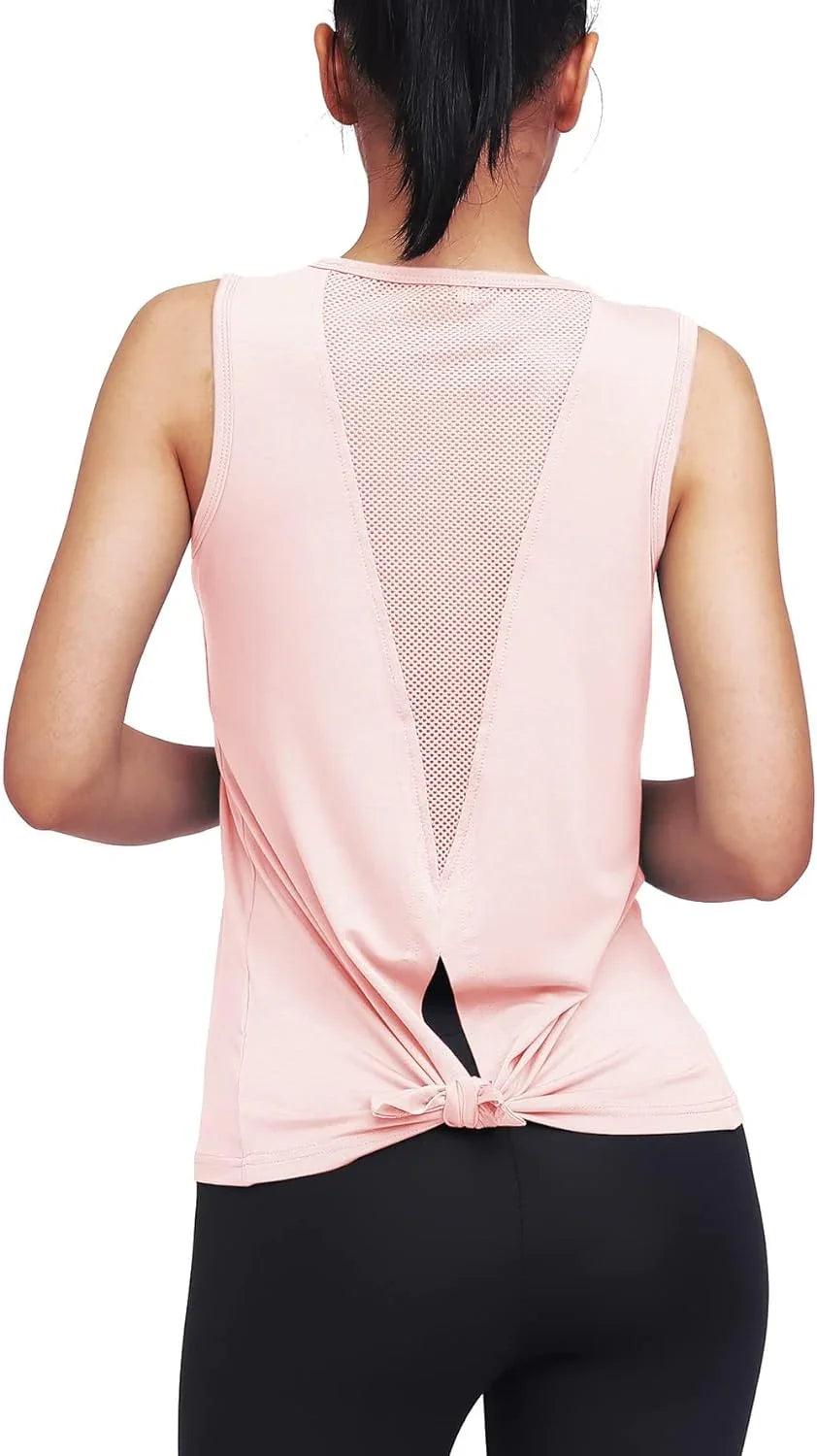Woman in pink mesh-back workout tank top and black leggings, seen from behind