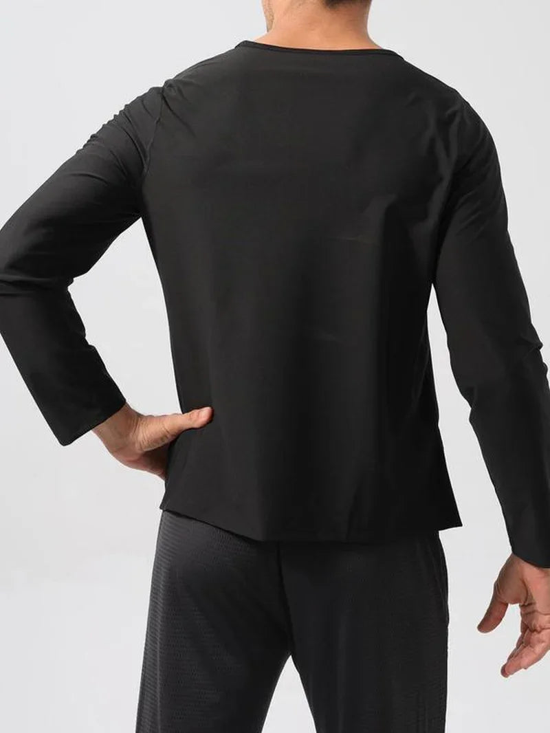 Back view of man wearing black long sleeve athletic shirt and dark workout pants